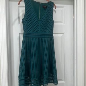 Emerald green tea length detailed dress